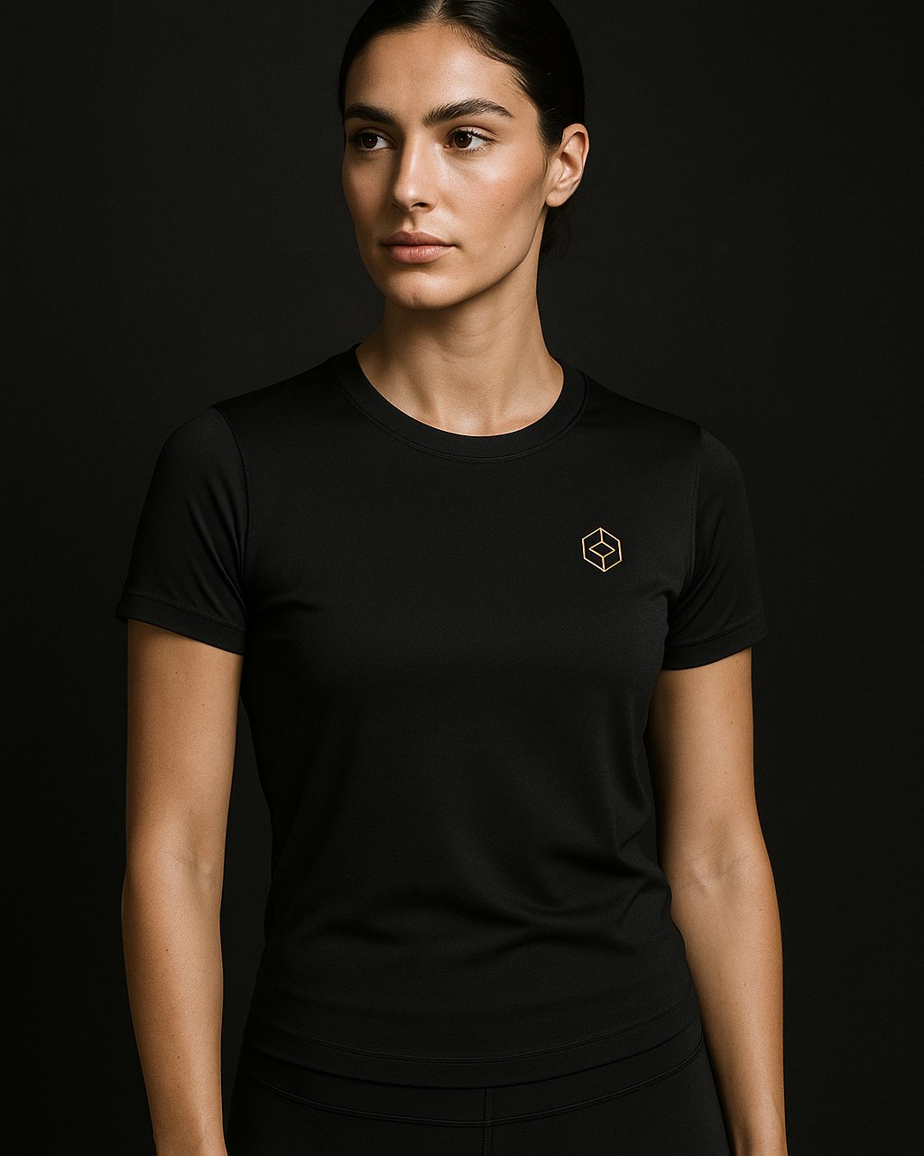 Studio Tee — fitted training tee with gold chest mark
